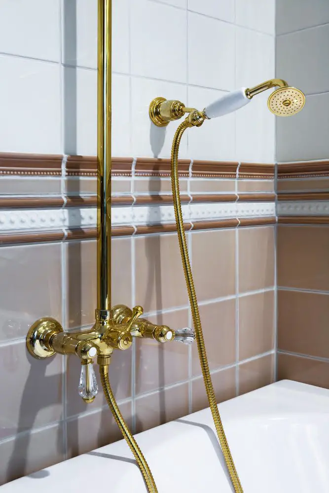 White Spa Shower With Gold Accents