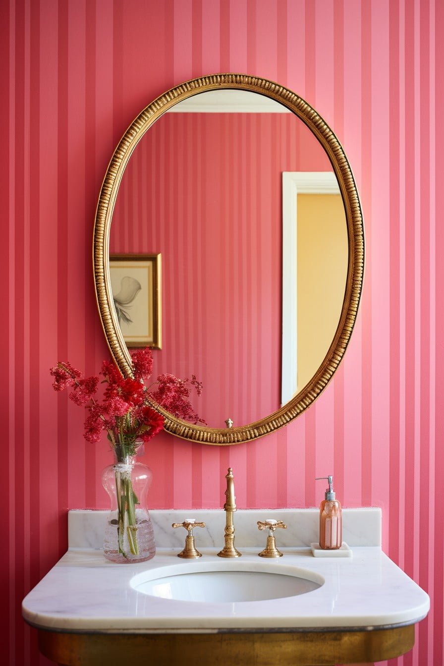 gold framed mirror against pink walls