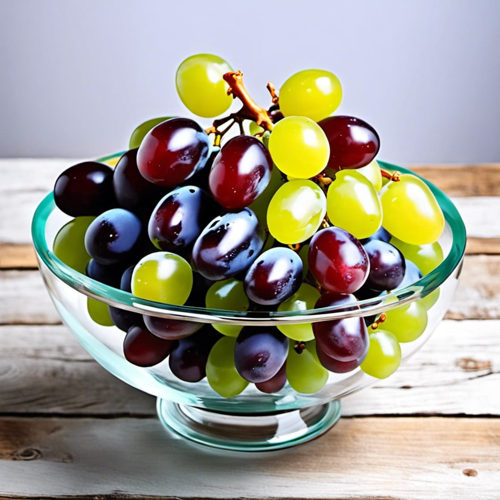 glass bowl filled with artificial grapes