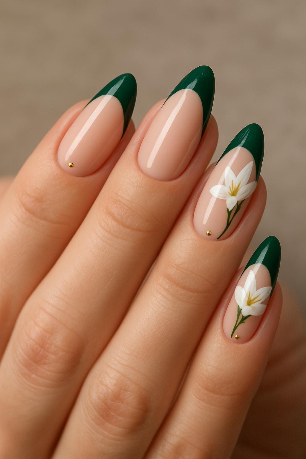 Almond nails with deep green French tips and white floral art