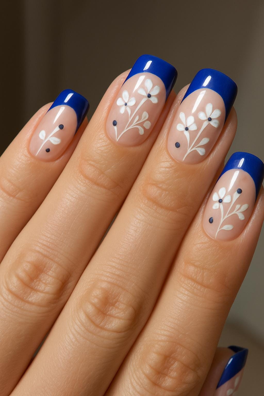 Blue French tips with daisy floral nail art