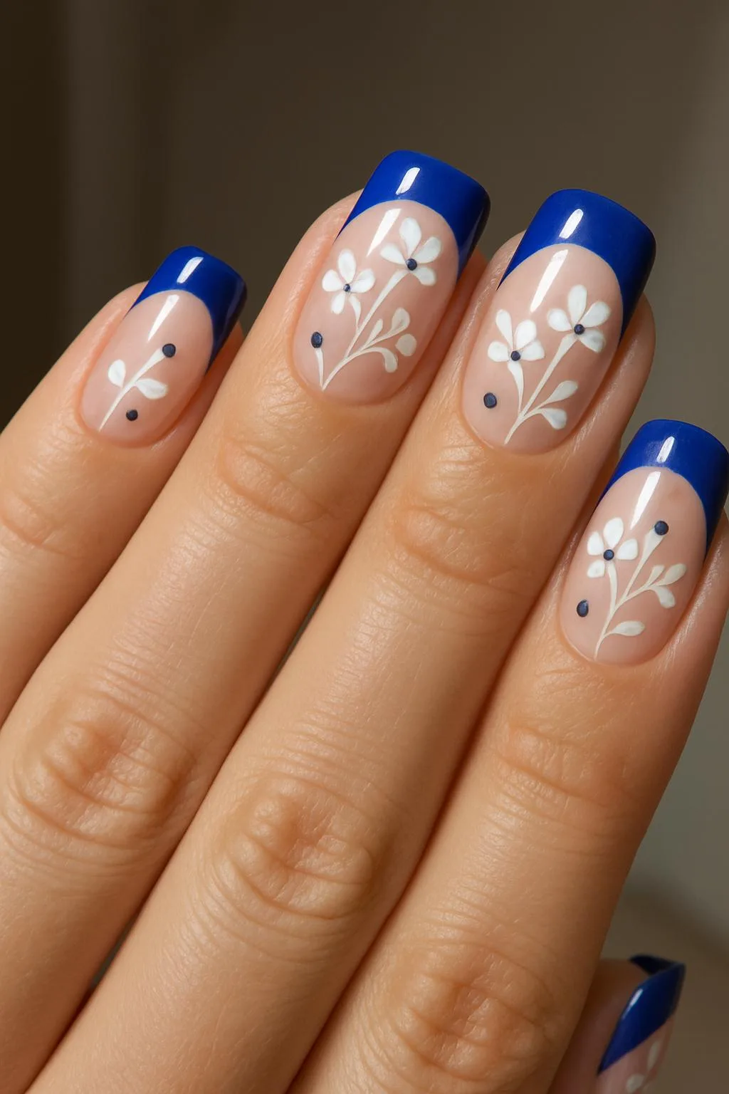 Blue French tips with daisy floral nail art