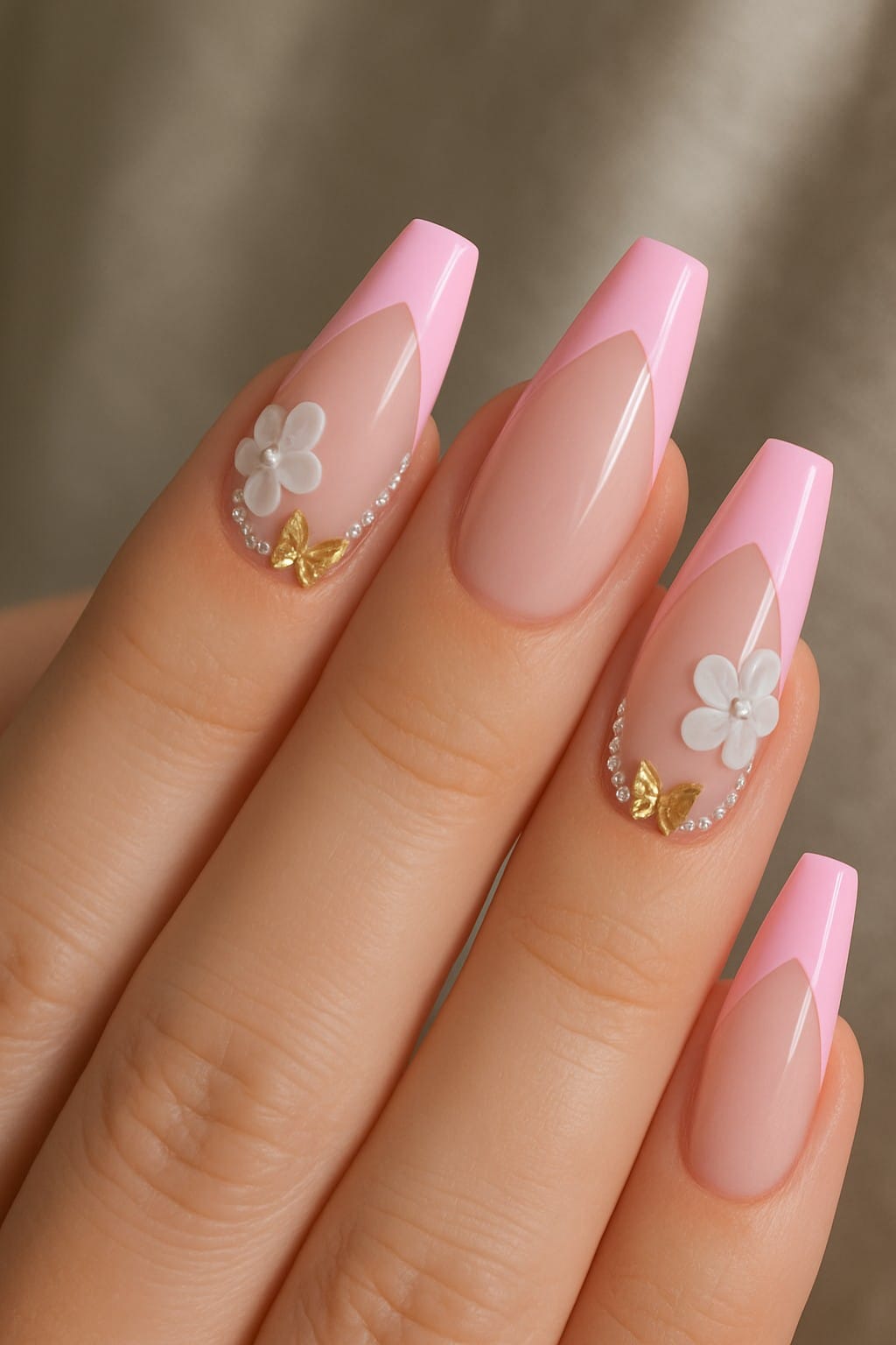 Pink french tips with 3D flowers and gold butterfly charms
