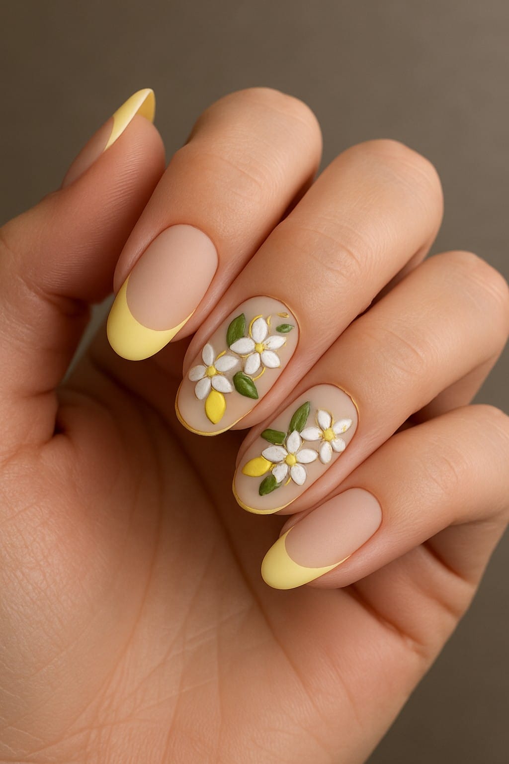 Yellow French tips and daisy accents with lemon details on nude nails